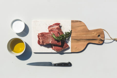 steaks-oil-salt-knife-and-a-cutting-board